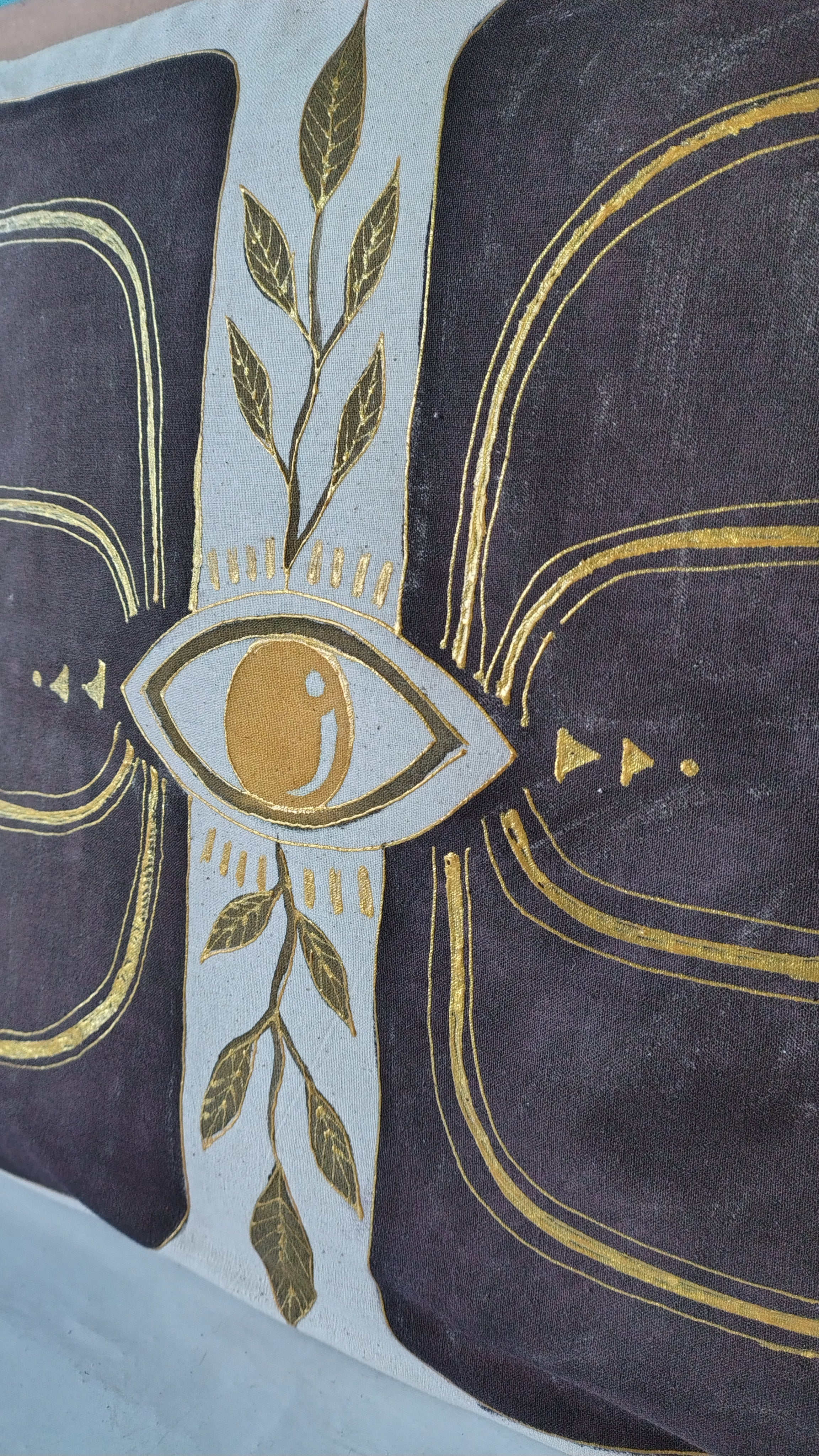 Decorative fabric with gold and green patterns on a dark background