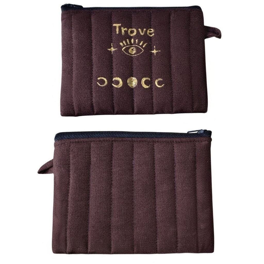 Brown pouch with 'Trove' branding and gold designs on a white background . luxurious bag