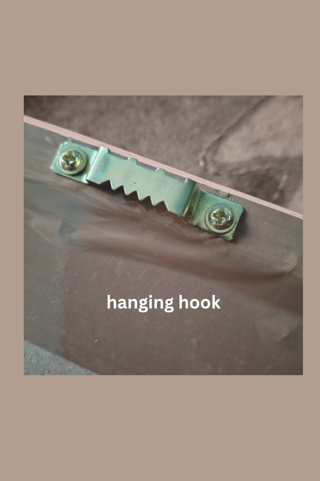 Hanging hook attached to a piece of furniture with a neutral background